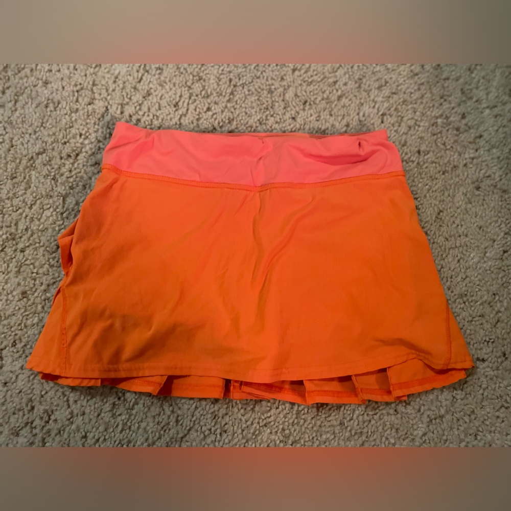 Bright orange tennis skirt
